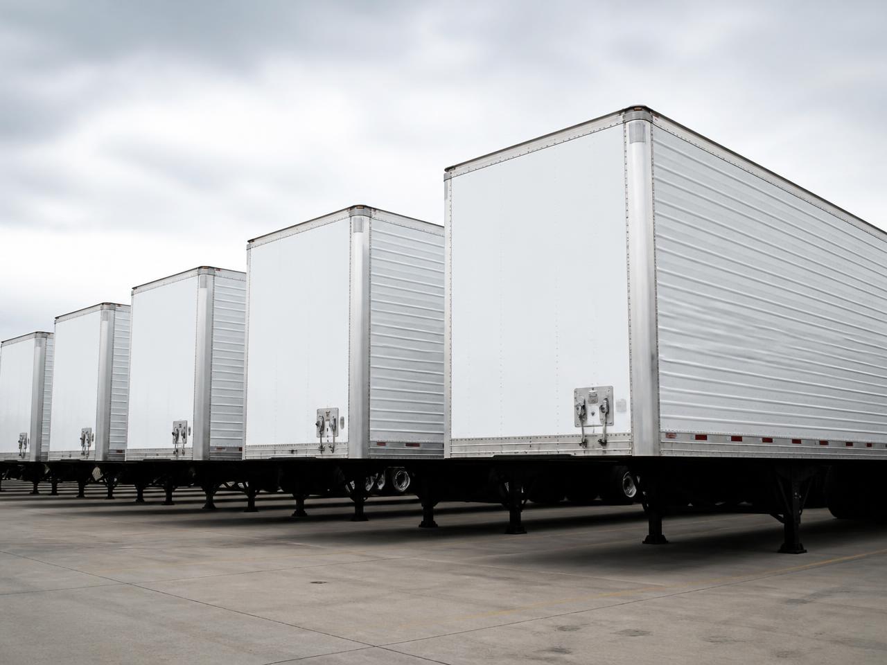 Commercial freight trailers parked in a row at a logistics yard